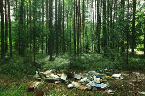 Workers managing construction debris efficiently